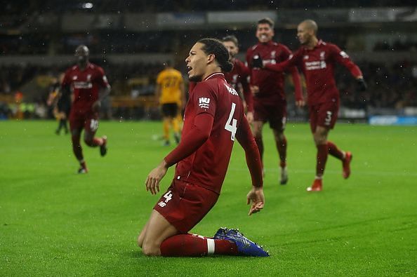 Virgil van Dijk of Liverpool FC celebrates after scoring a goal.